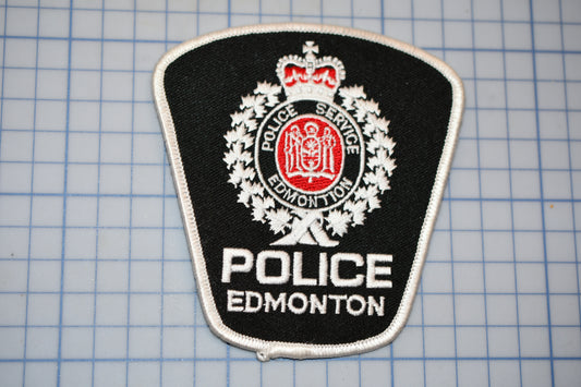 a police badge is shown on a cutting board