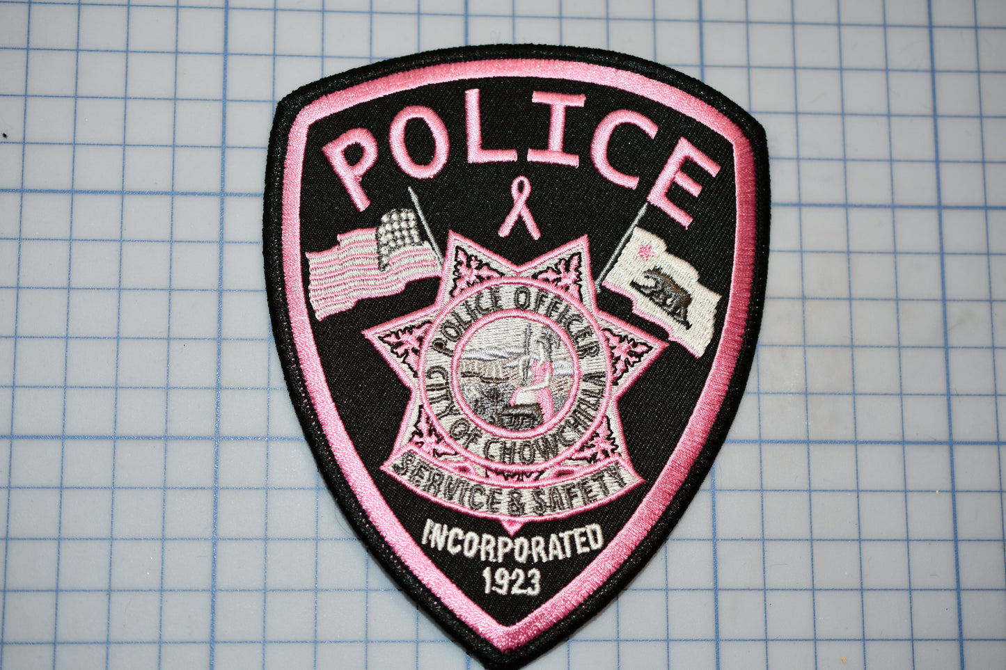 a police patch on a piece of paper