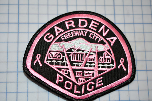 a pink and black patch with the words gardena freeway city police