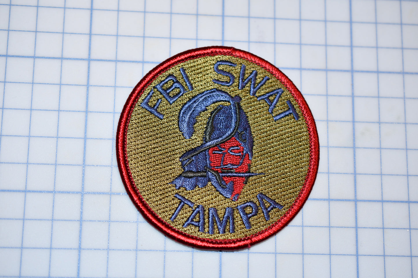 a patch with a picture of a person wearing a helmet