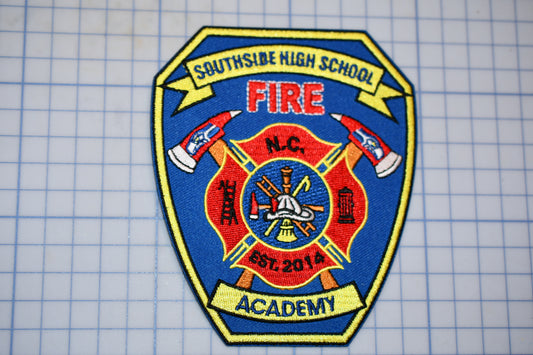 a fire department patch on a cutting board