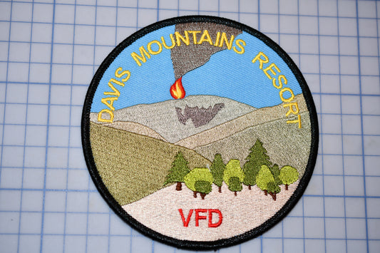 a patch with a picture of a volcano on it