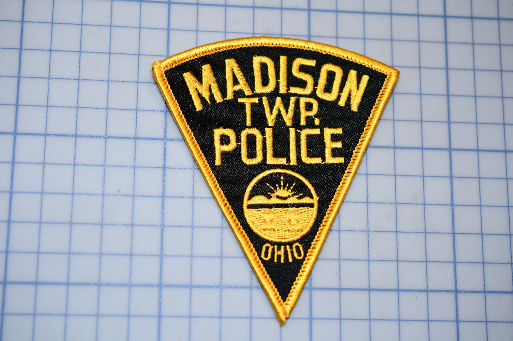 a police patch that says madison twp police