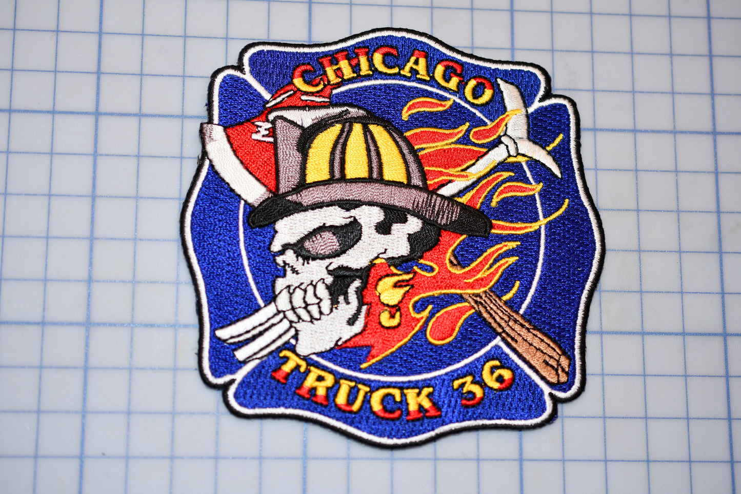 a chicago truck company patch with a skull wearing a fireman's hat and