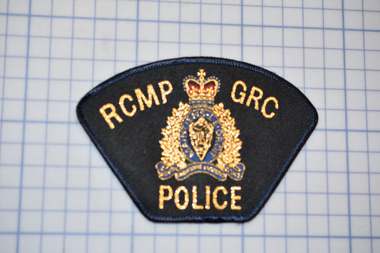 a rcmp badge is shown on a piece of paper