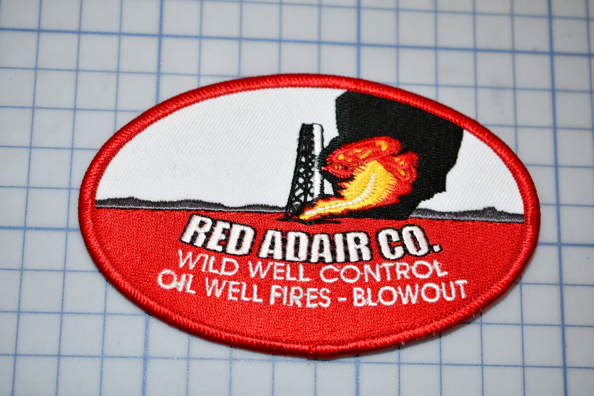 a patch with a picture of a fire extinguisher