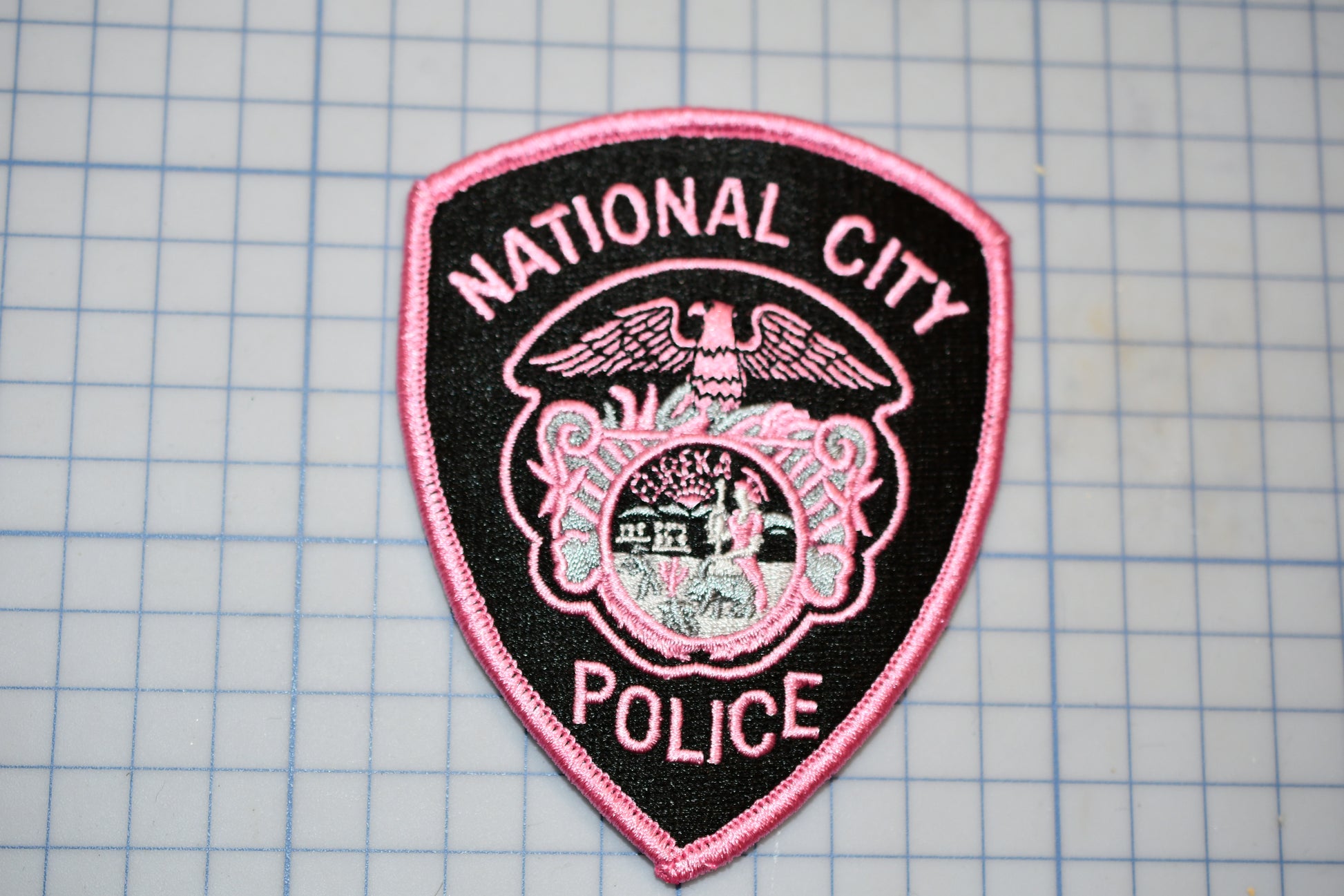 a police badge is shown on a cutting board