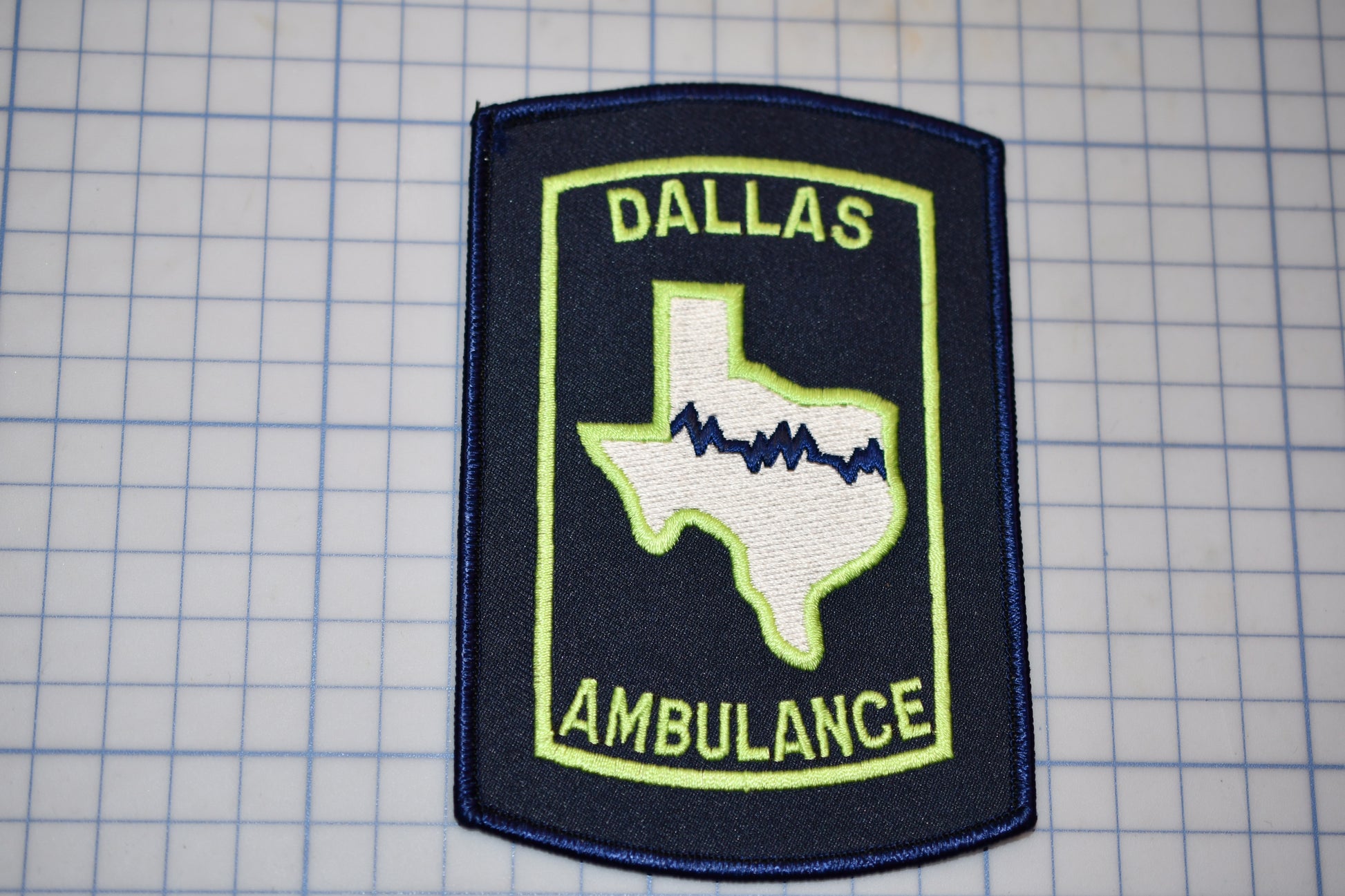 a patch with a picture of the state of texas on it