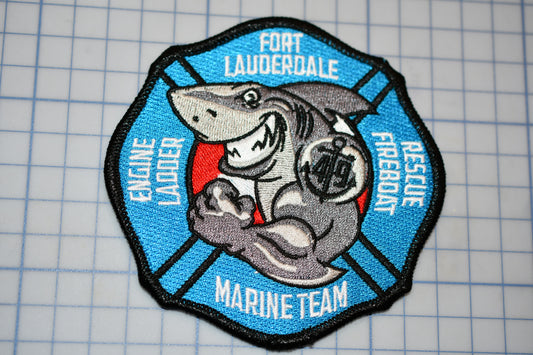 a patch with a picture of a shark on it