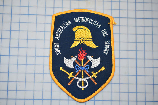 a patch with a picture of two swords and a helmet on it