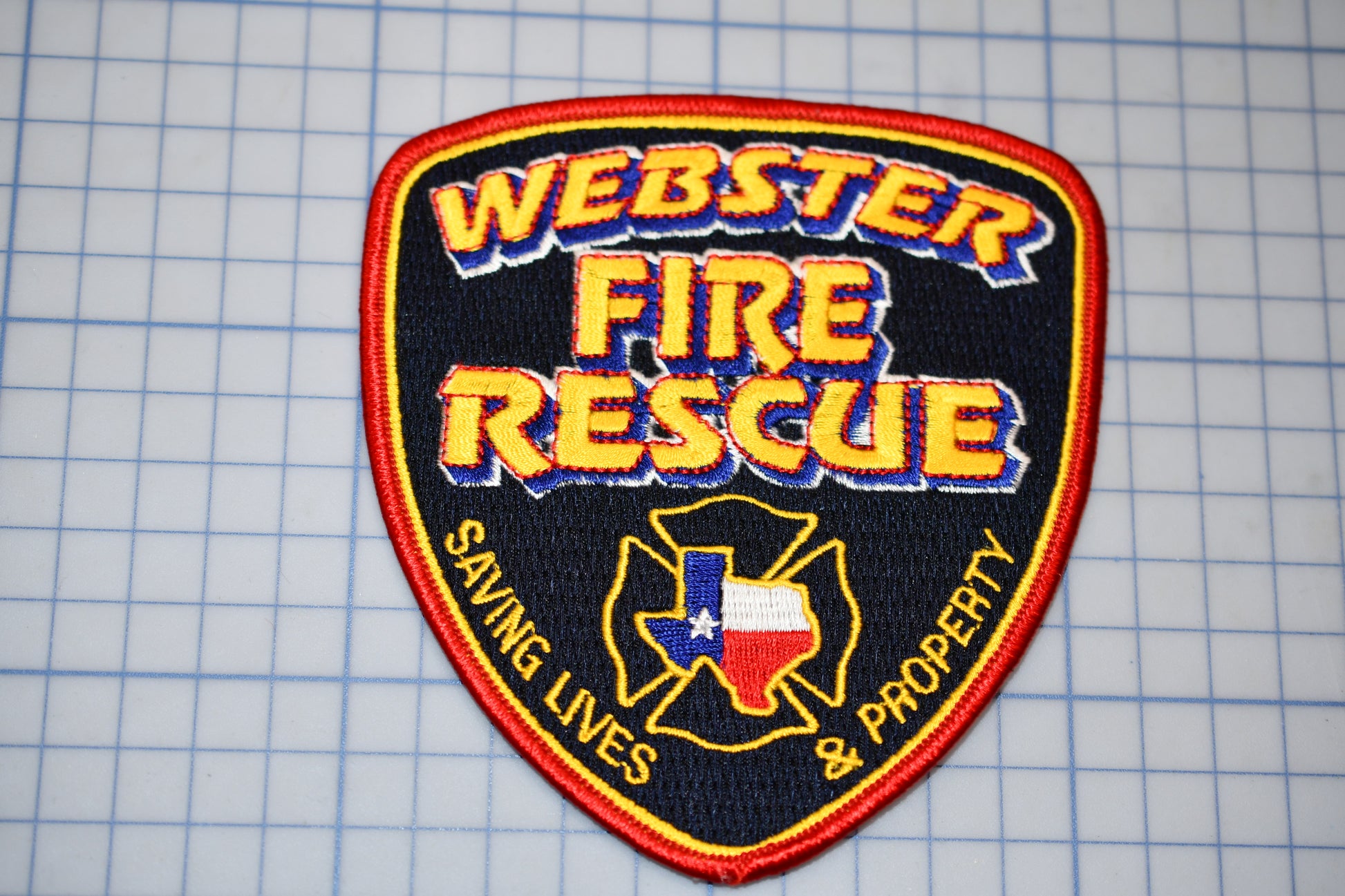 a fire rescue patch sitting on top of a cutting board