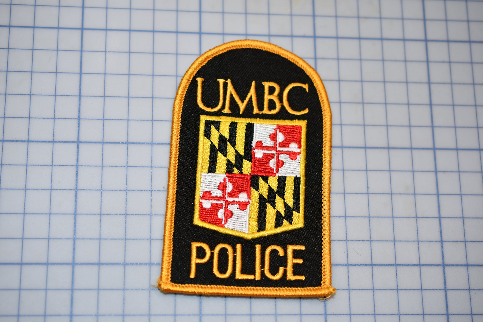 a patch with the words umbc police on it