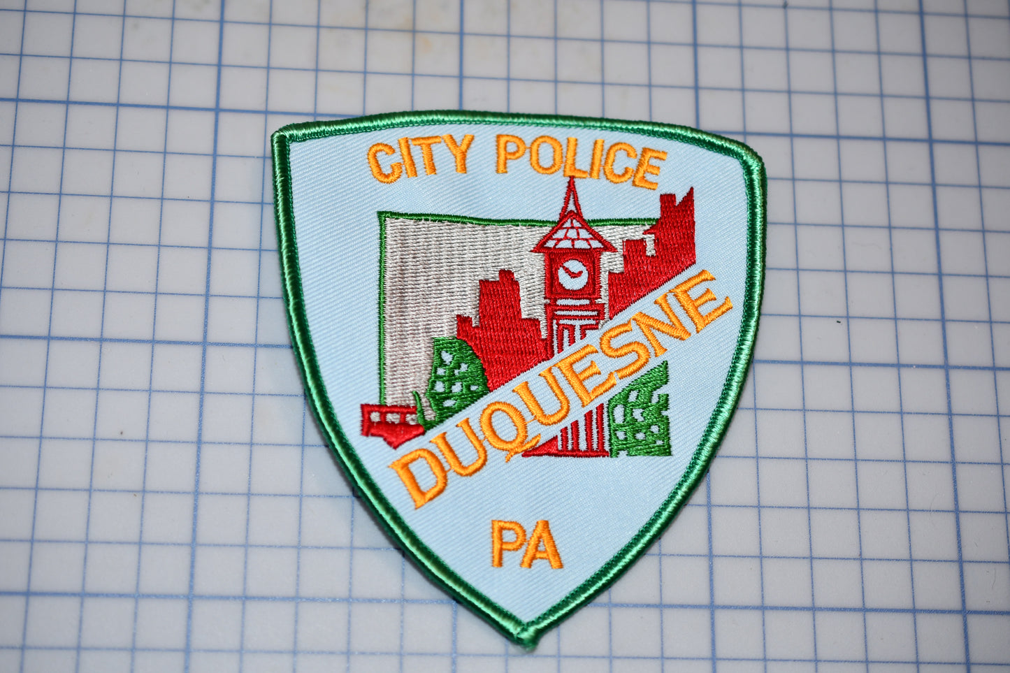 a city police patch on a cutting board