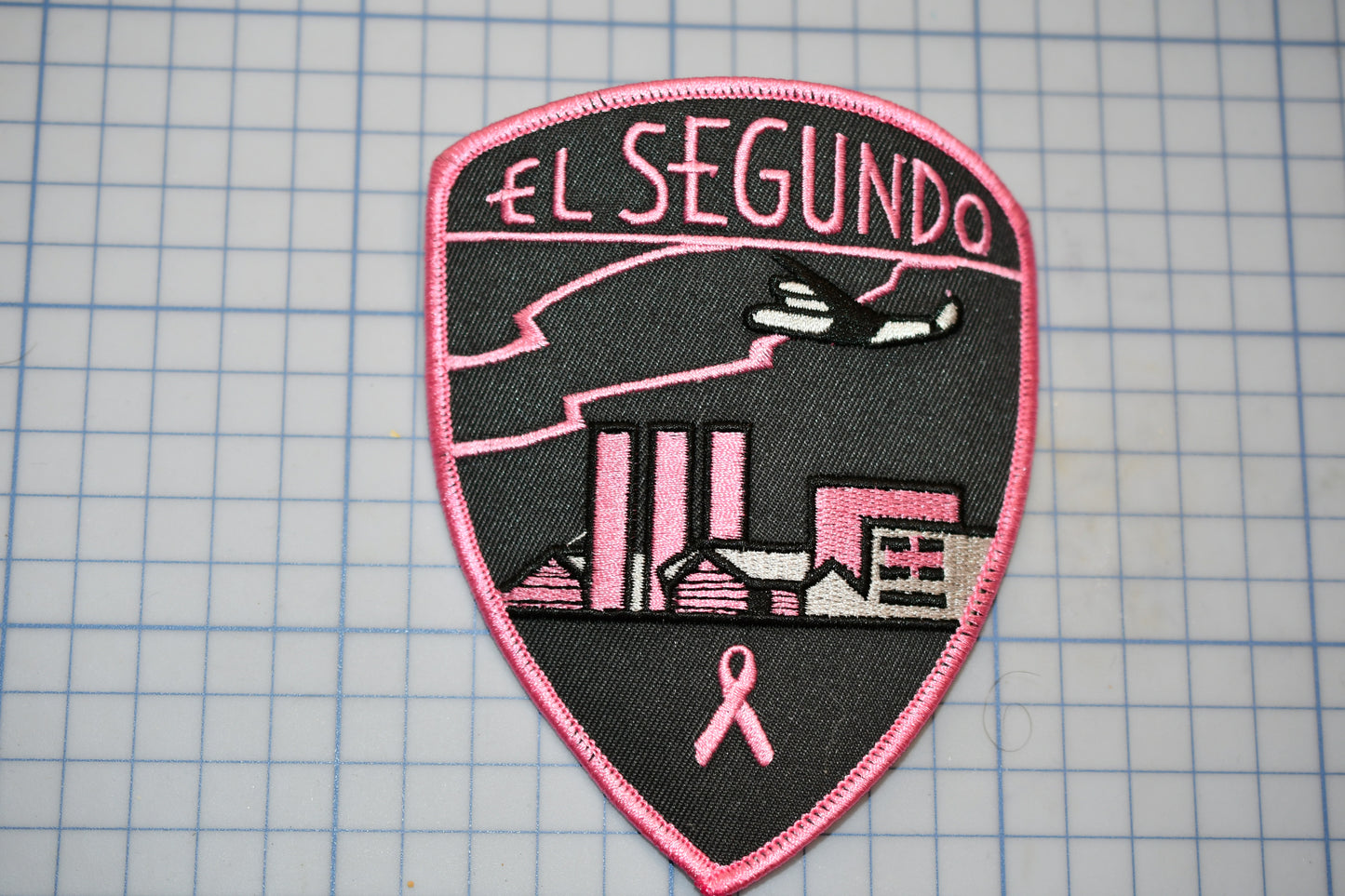 a patch that says el segundo on it