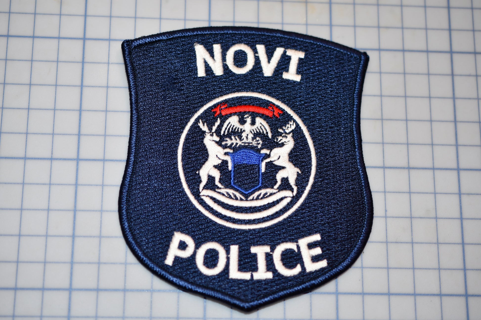 a police badge is shown on a cutting board