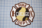 a chicago fire department patch on a cutting board