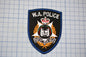 a police patch on a piece of paper