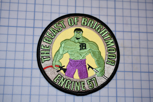 a patch with a picture of a man with a hammer