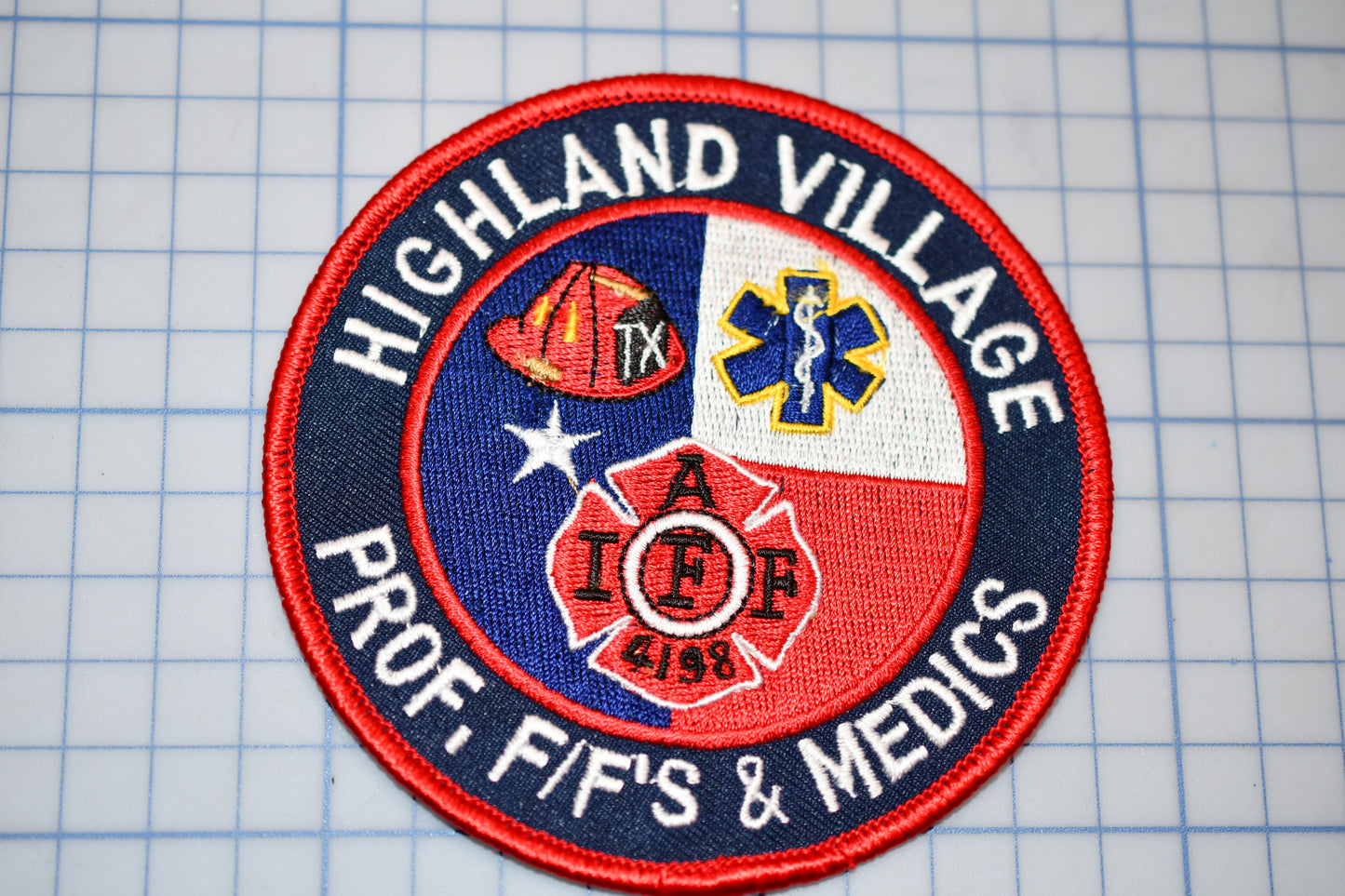 a patch with the words highland village fire and ems on it