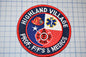 a patch with the words highland village fire and ems on it