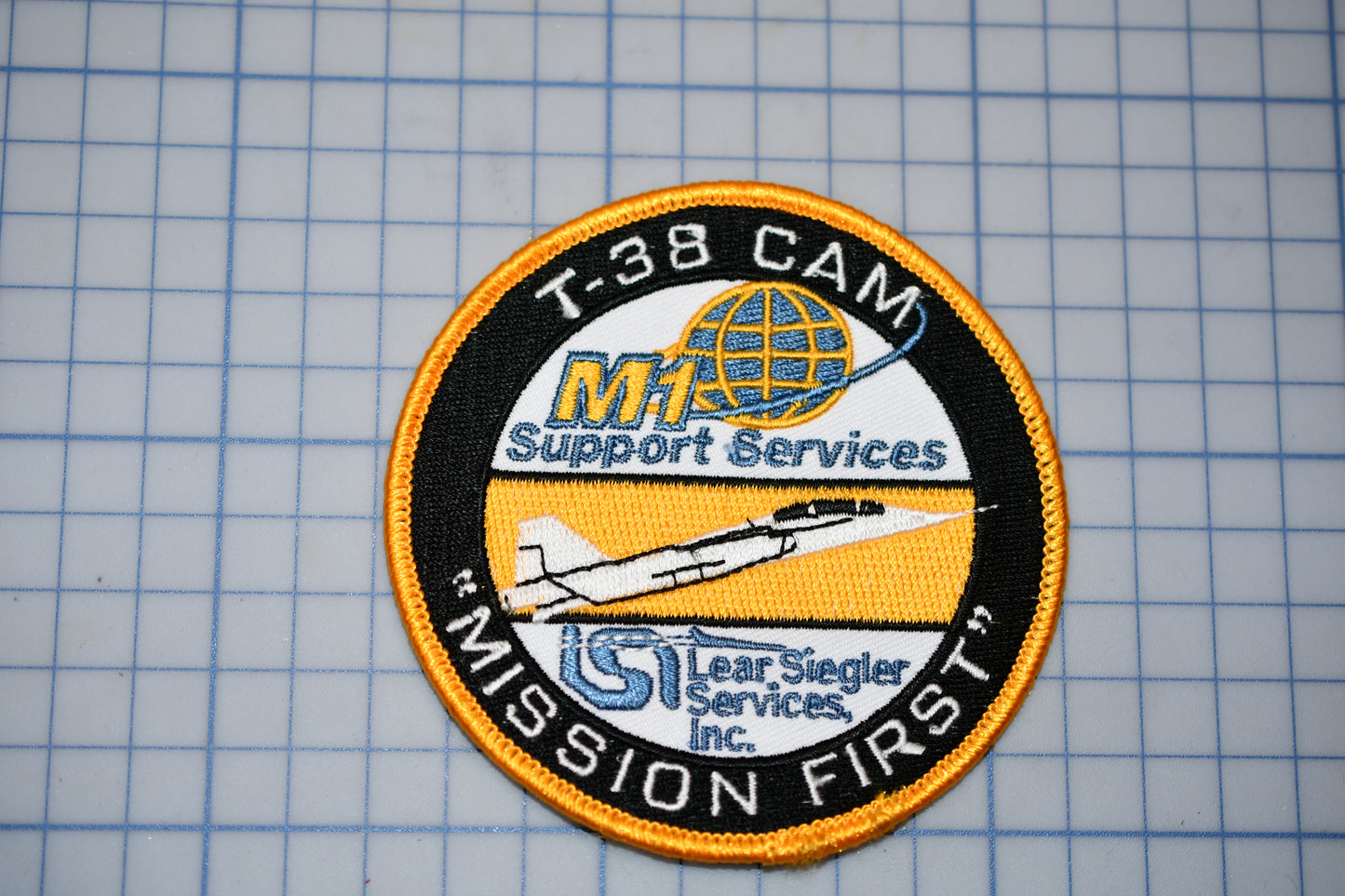 a patch with the words mission first on it