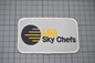 the lsg sky chefs logo on a white patch