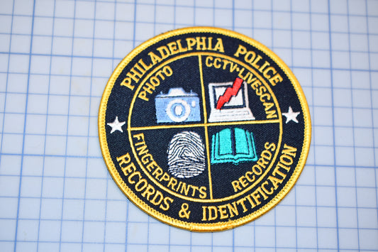 a badge with a fingerprint and a fingerprint on it