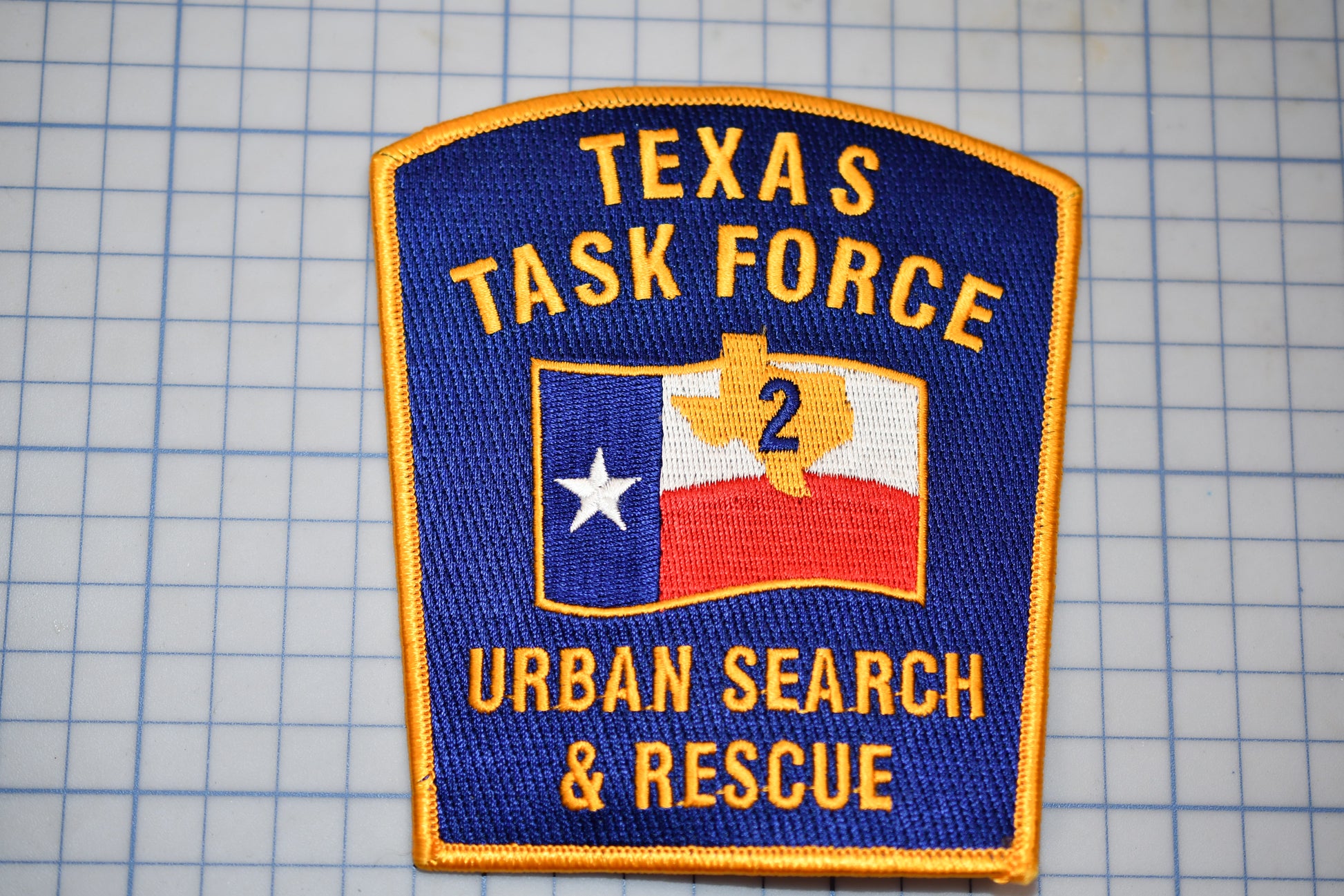 a texas task force patch on a cutting board