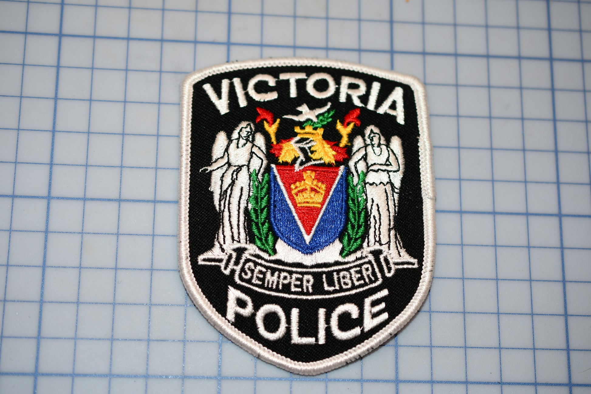 a victoria police patch on a cutting board