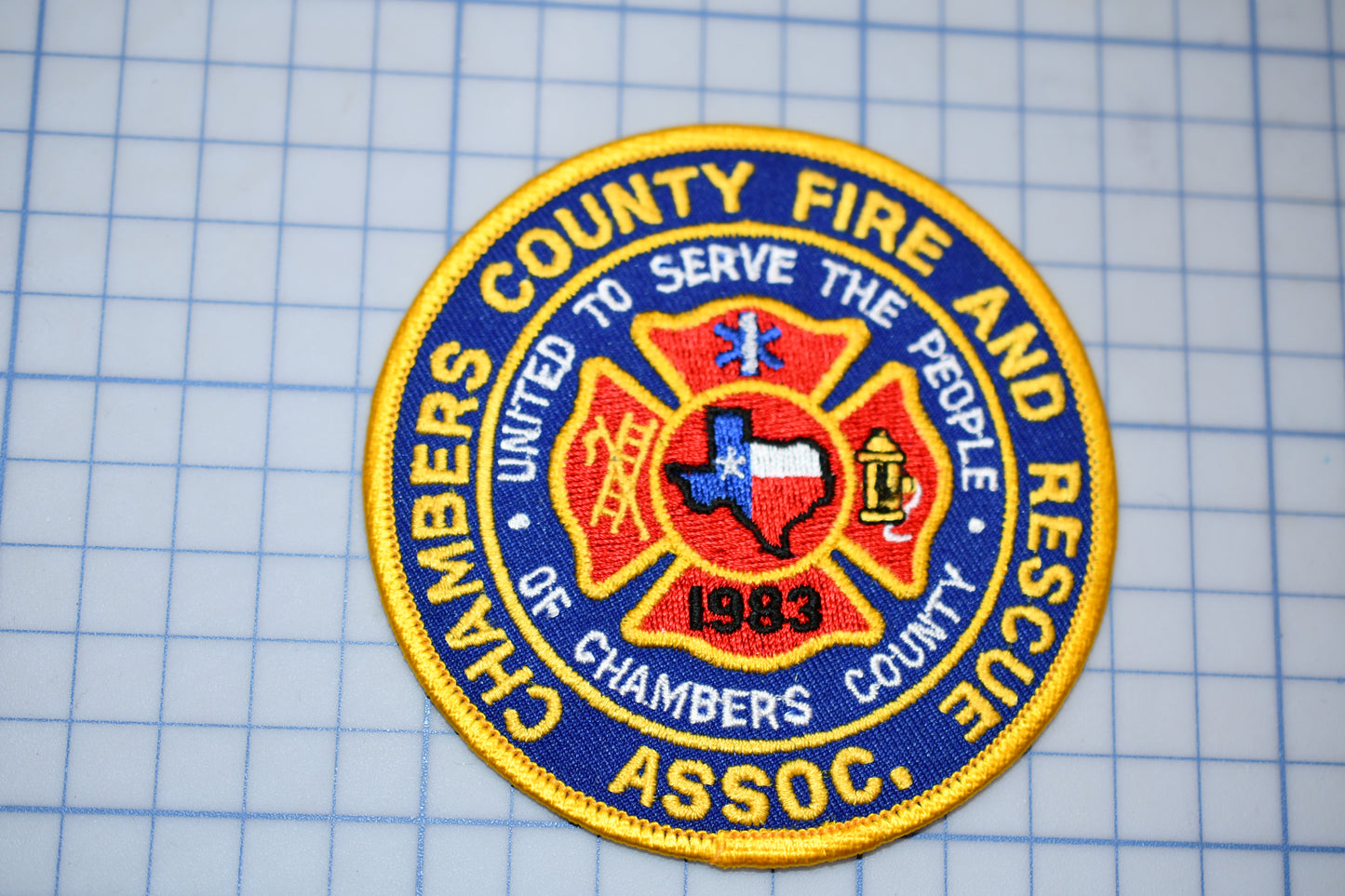 a fire and rescue patch on a cutting board