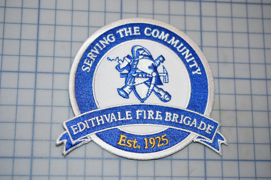 a blue and white patch with the words serving the community