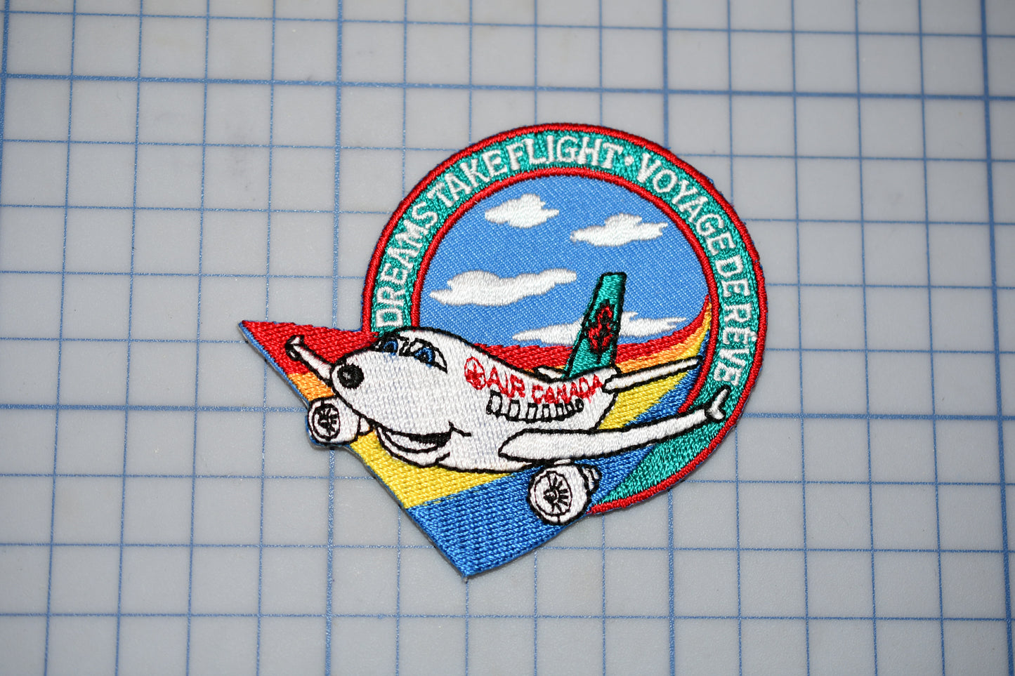 a patch with a plane on it on a table