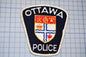 a ottawa police patch on a cutting board