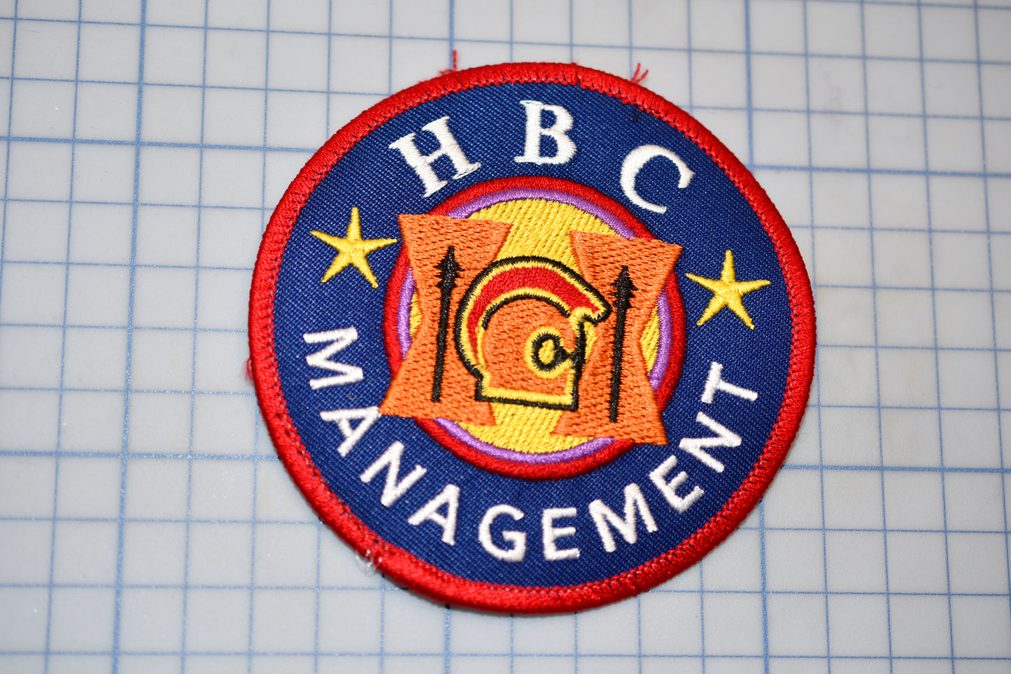 a patch with the words hbc management on it