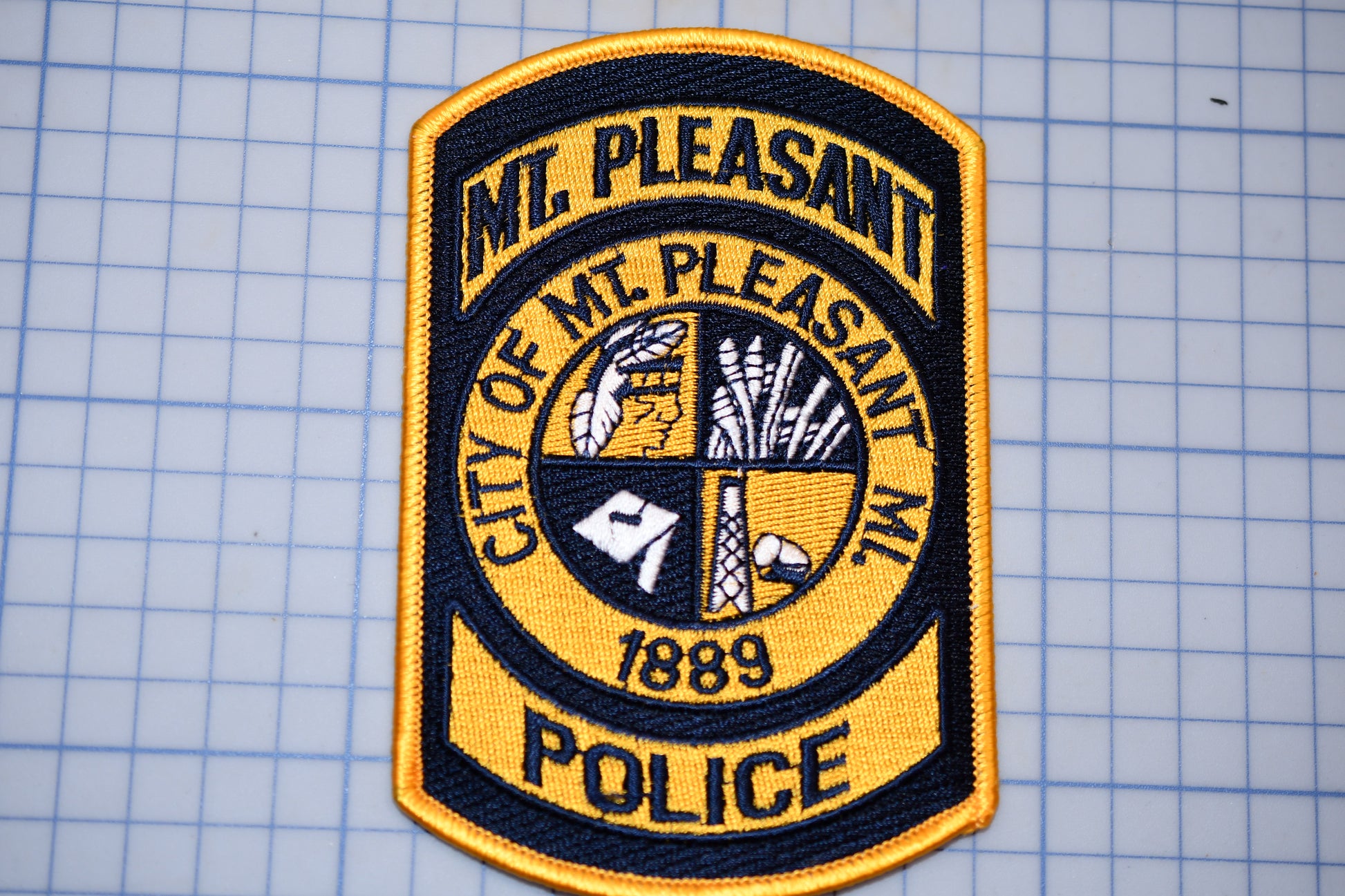 a police patch on a piece of paper