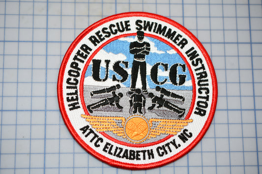 a patch with a picture of a man on a surfboard