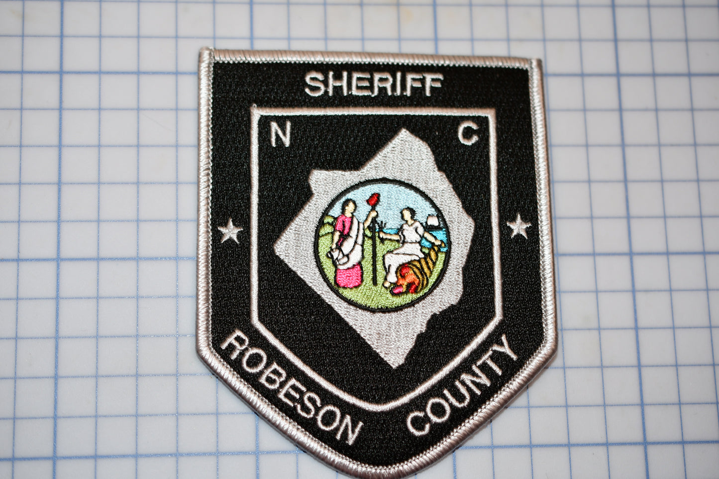 a patch with a picture of a person on it