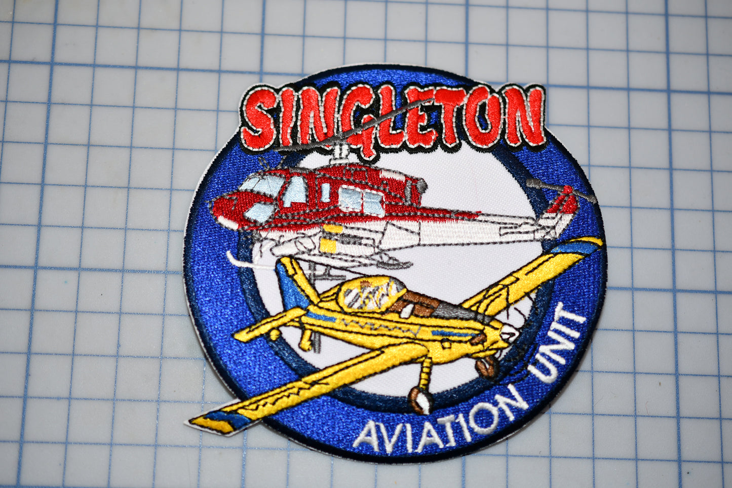 a patch with a picture of a plane and the words singletonton aviation unit