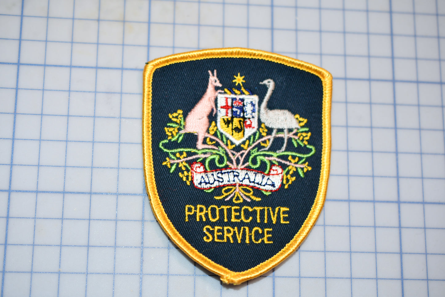 a police badge on a piece of paper