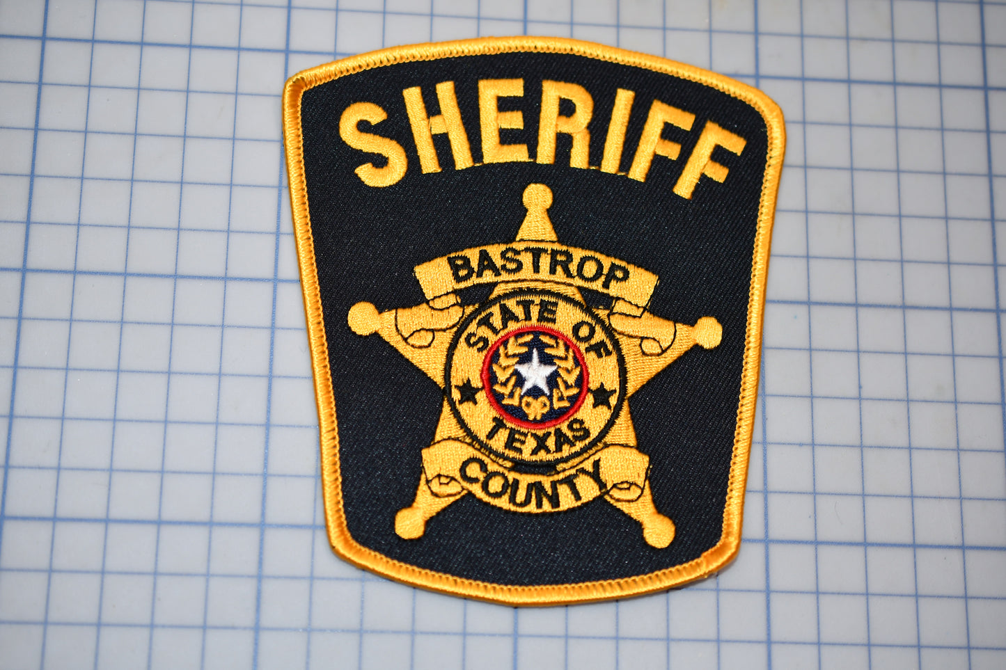 a patch that says sheriff on it