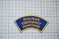 a blue and yellow patch with the words syncrude emergency response