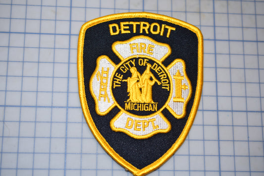 a detroit fire department patch on a cutting board