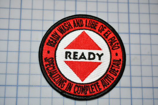 a red and black patch with the words ready on it