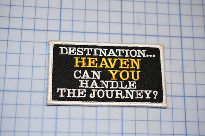 a black and white patch with a quote on it