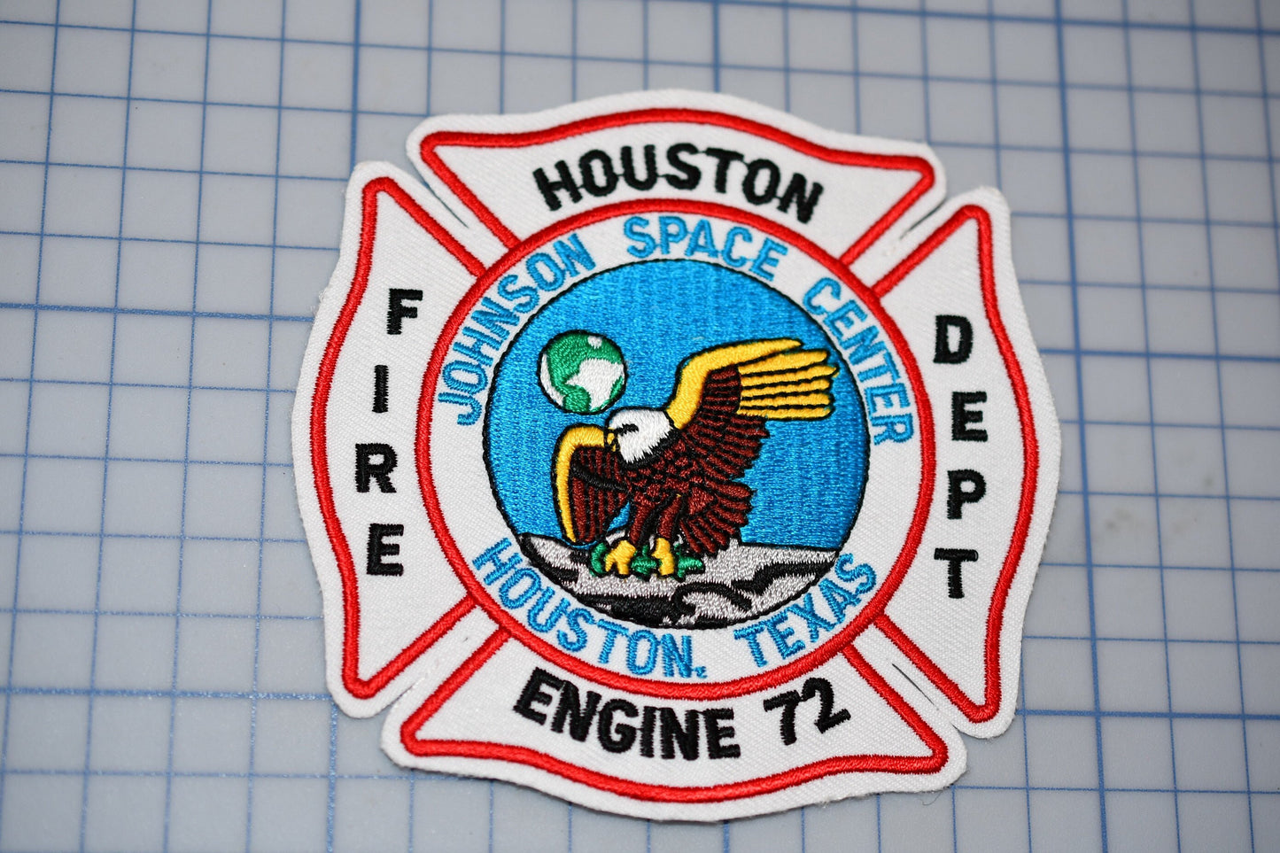 a houston fire department patch on a cutting board