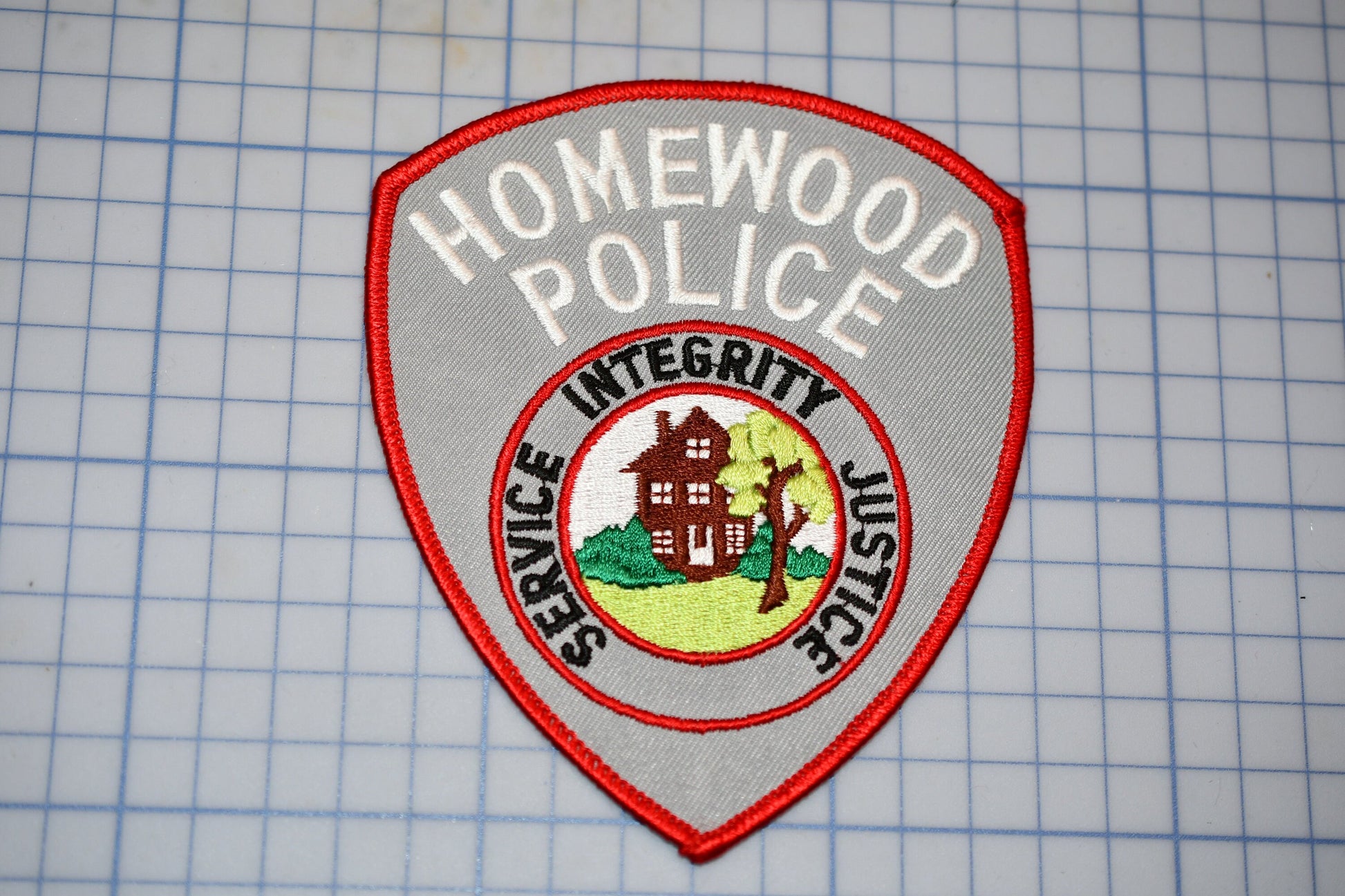 a police badge is shown on a piece of paper