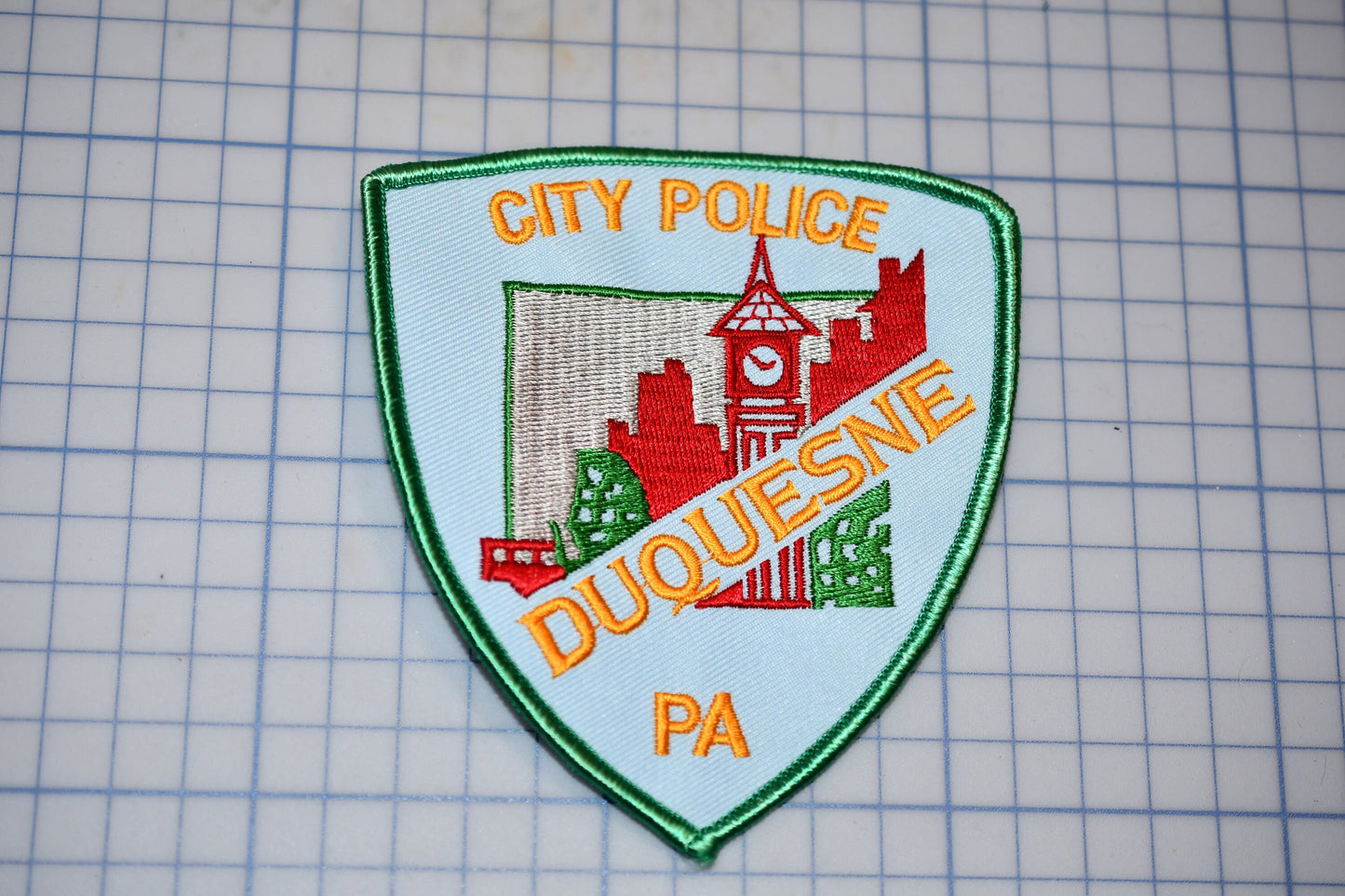 a city police patch on a cutting board