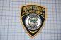 a police badge is shown on a piece of paper